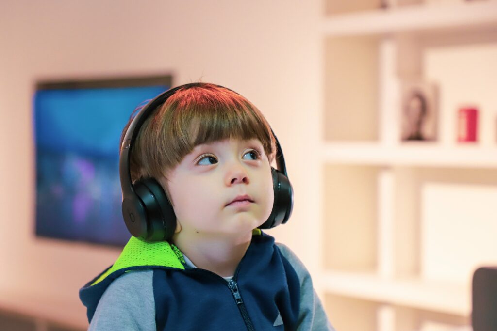 boy near white wooden shelf